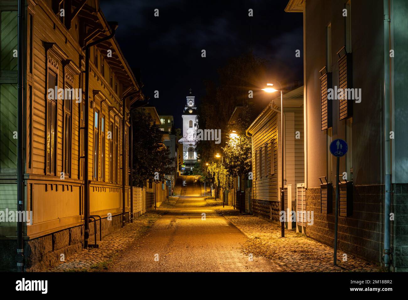 Vahtivuorenkatu street view with Kuopion tuomiokirkko or Kuopio Cathedral after dark in Vahtivuori district of Kuopio, Finland Stock Photo