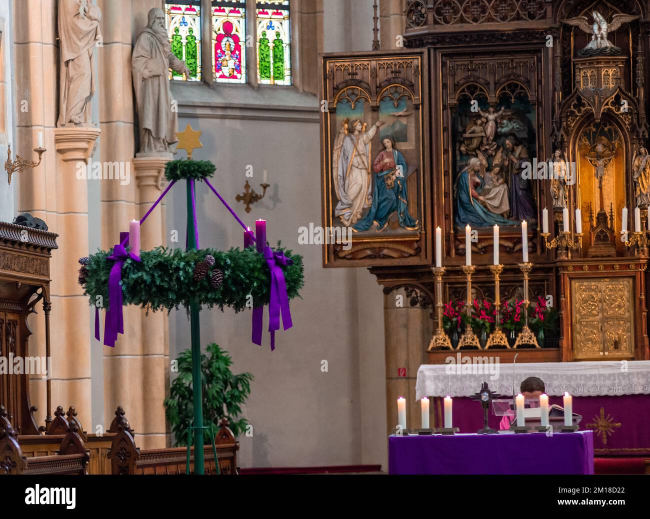 Neuoetting,GermanyDecember 11,2022 Three candles are lit on an