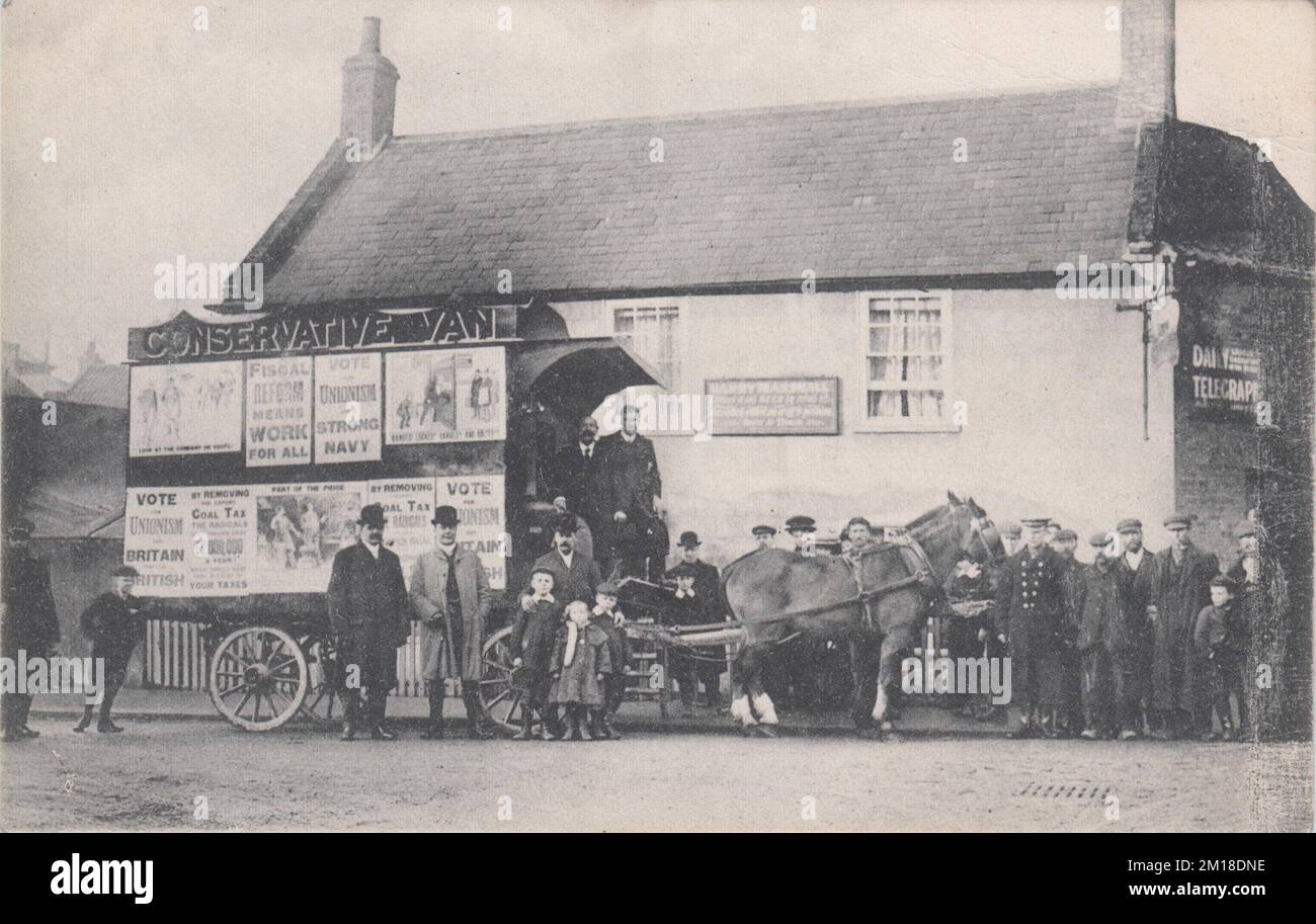 Horse drawn 'Conservative Van' used by the Conservative Party for publicity campaigns from 1907 onwards. This van was one of a series of 'propaganda vans' which were designed to travel to towns & villages across the country &, due to their novelty, attract the attention of interested locals (working class voters were particularly targeted). The vans were decorated with political posters featuring bold slogans & cartoons, & used new technology such as gramophone recordings of speeches and 'cinematograph pictures'. Live Party speakers also accompanied the vans to address potential voters. Stock Photo