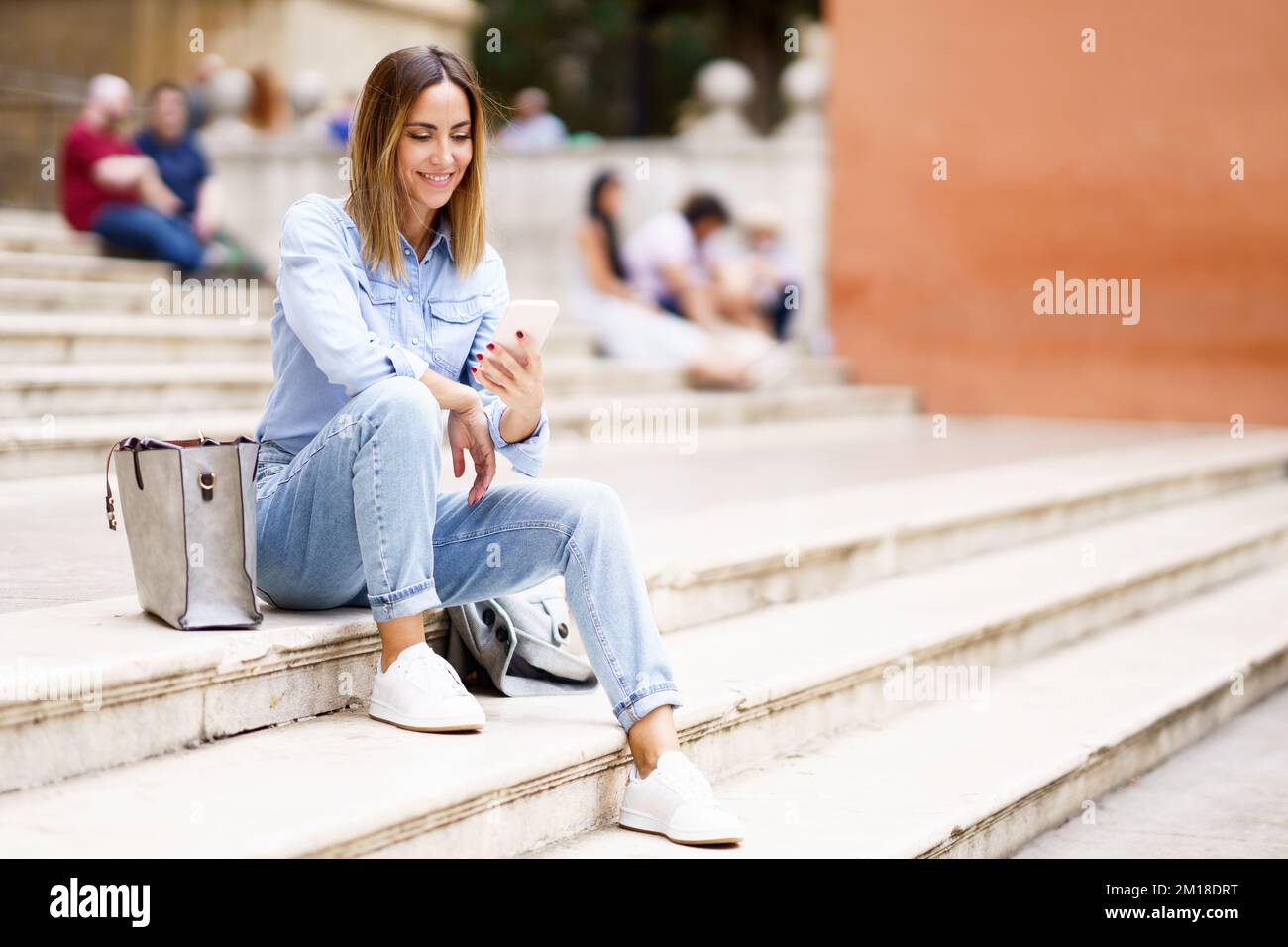 Woman looking at watch happy smile hi-res stock photography and images ...