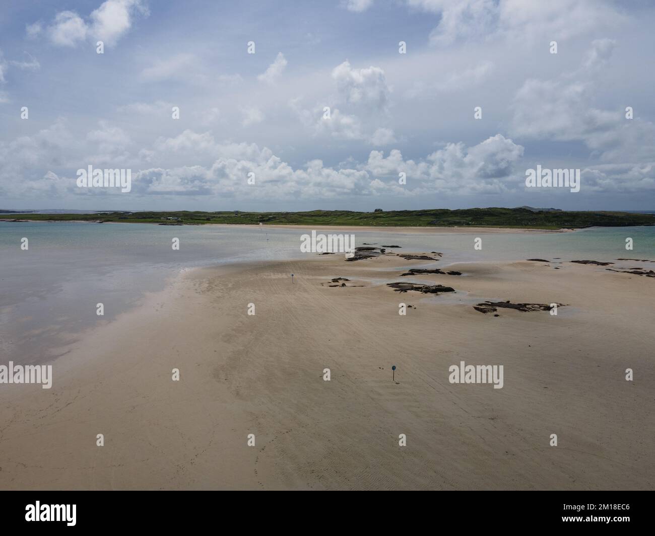 Ireland, way to the Omey Island. Drone shot, day light. It is possible to drive across the beach when the tide is out. Stock Photo