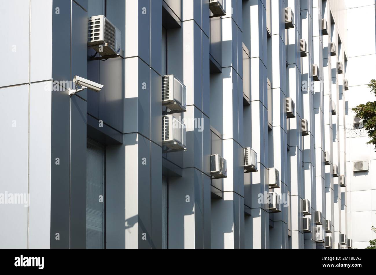 Many HVAC air conditioning and ventilation systems on wall. Outdoor Air