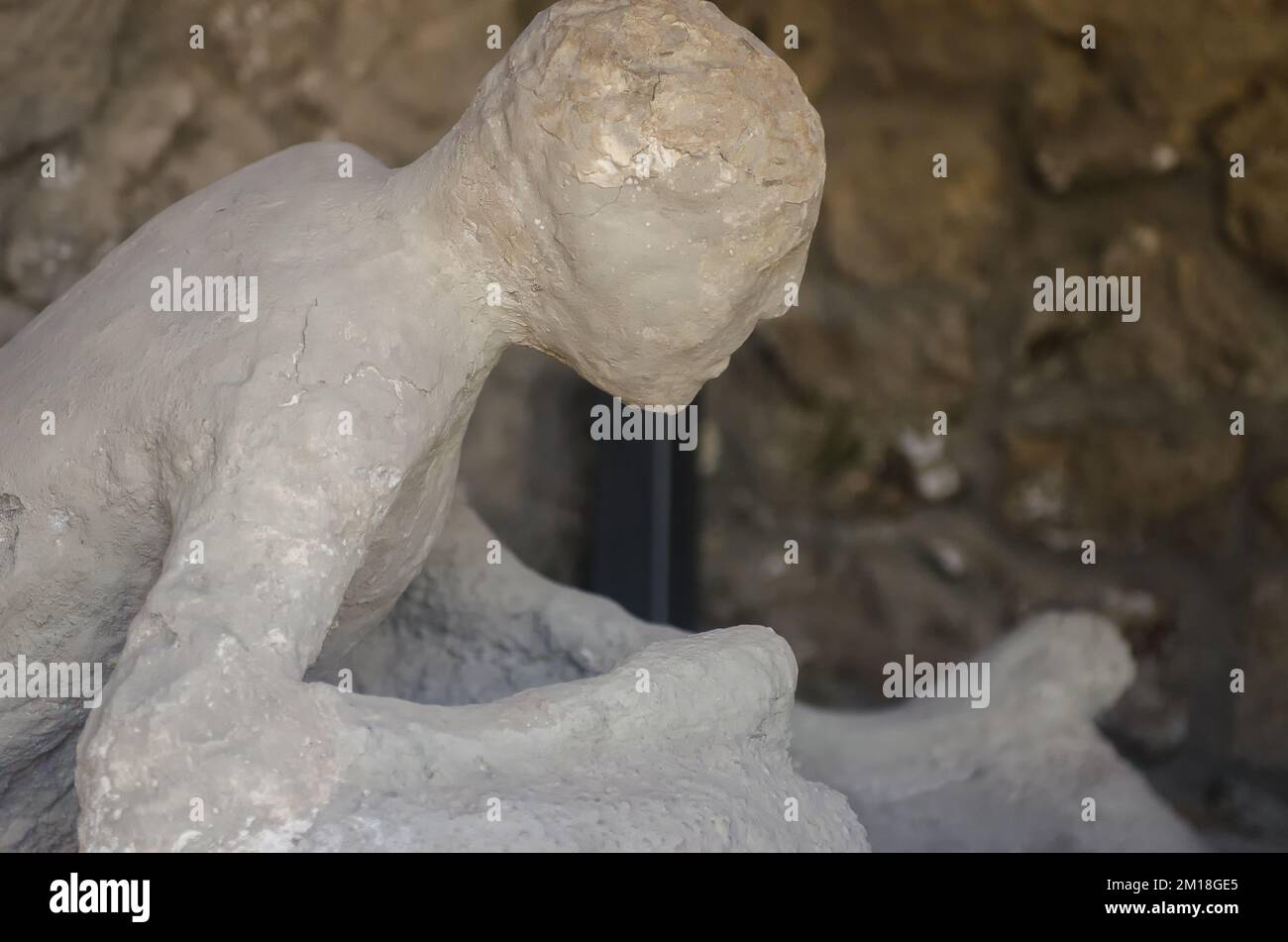 A plaster cast of a man in his last moments. Pompeii, Italy. High quality photo Stock Photo