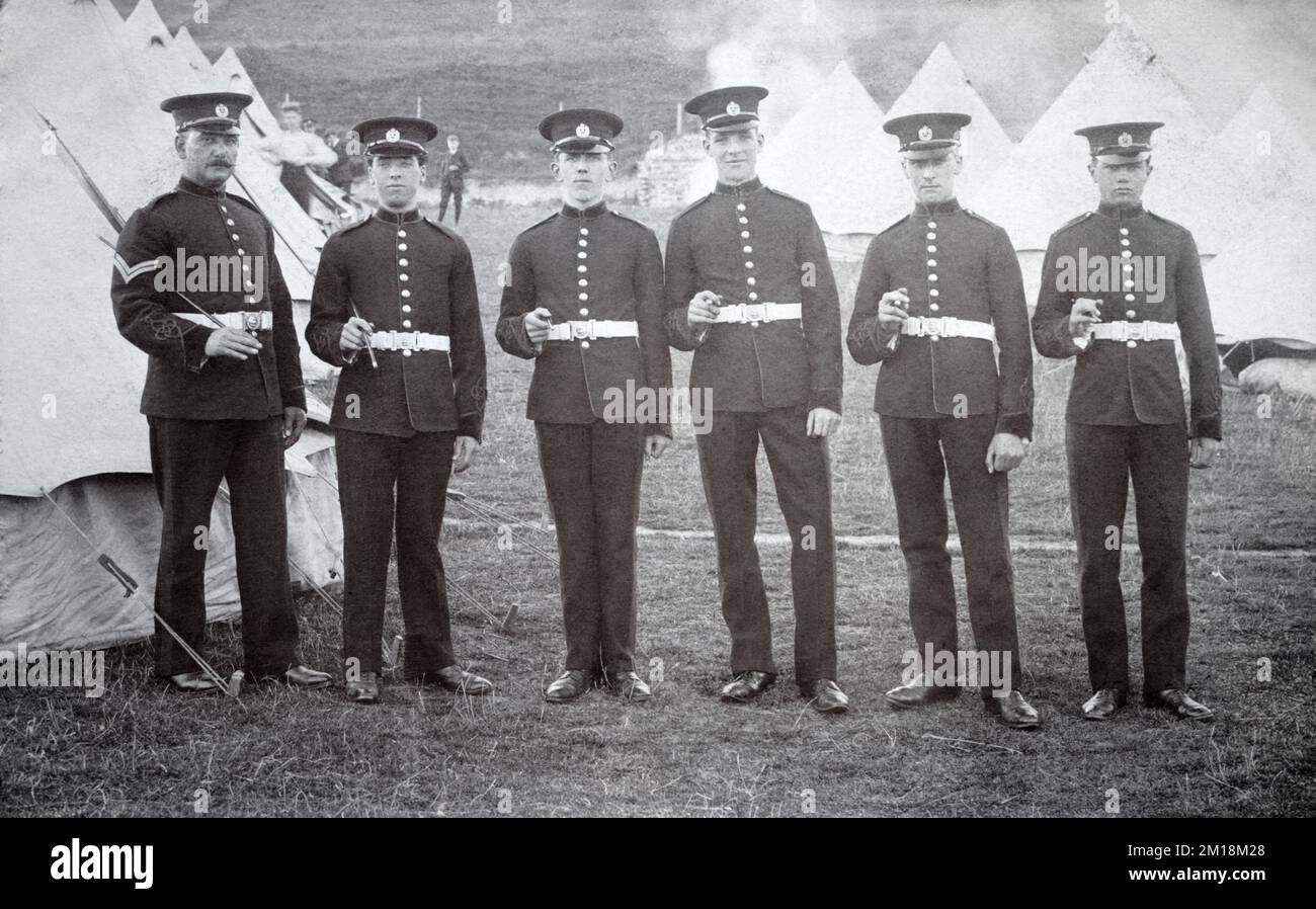 A group of Royal Engineer soldiers of the Territorial Force on their annual camp amongst bell tents. Stock Photo