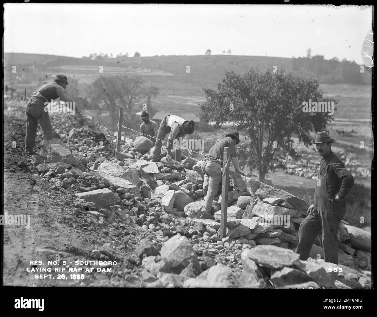 Sudbury Reservoir, laying riprap on north end of Sudbury Dam, from the
