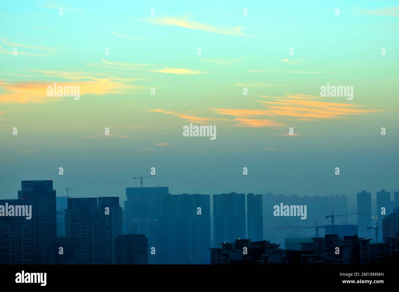 sunset over the city Stock Photo - Alamy