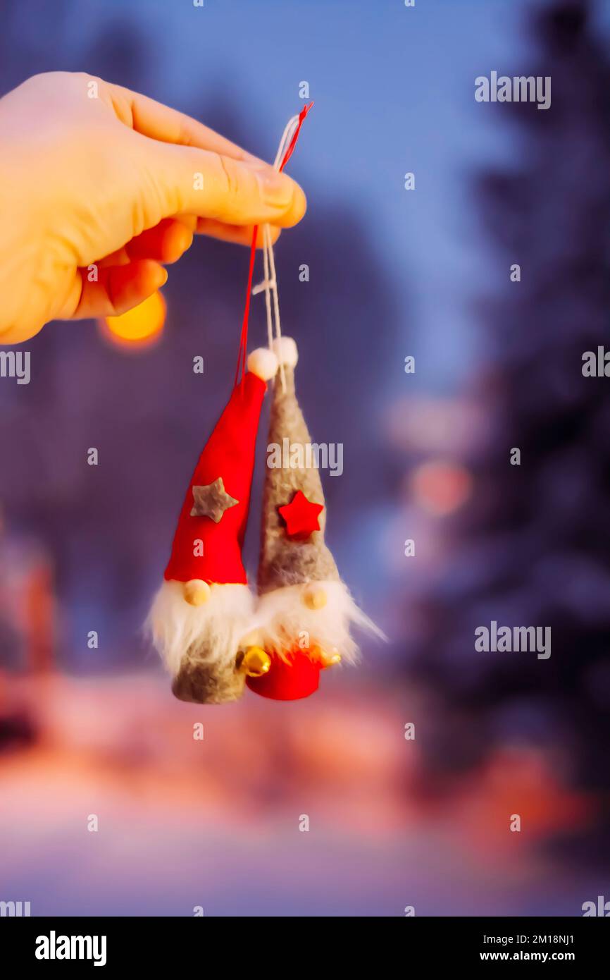https://c8.alamy.com/comp/2M18NJ1/cute-gnomes-in-red-hat-decorative-christmas-toys-2M18NJ1.jpg