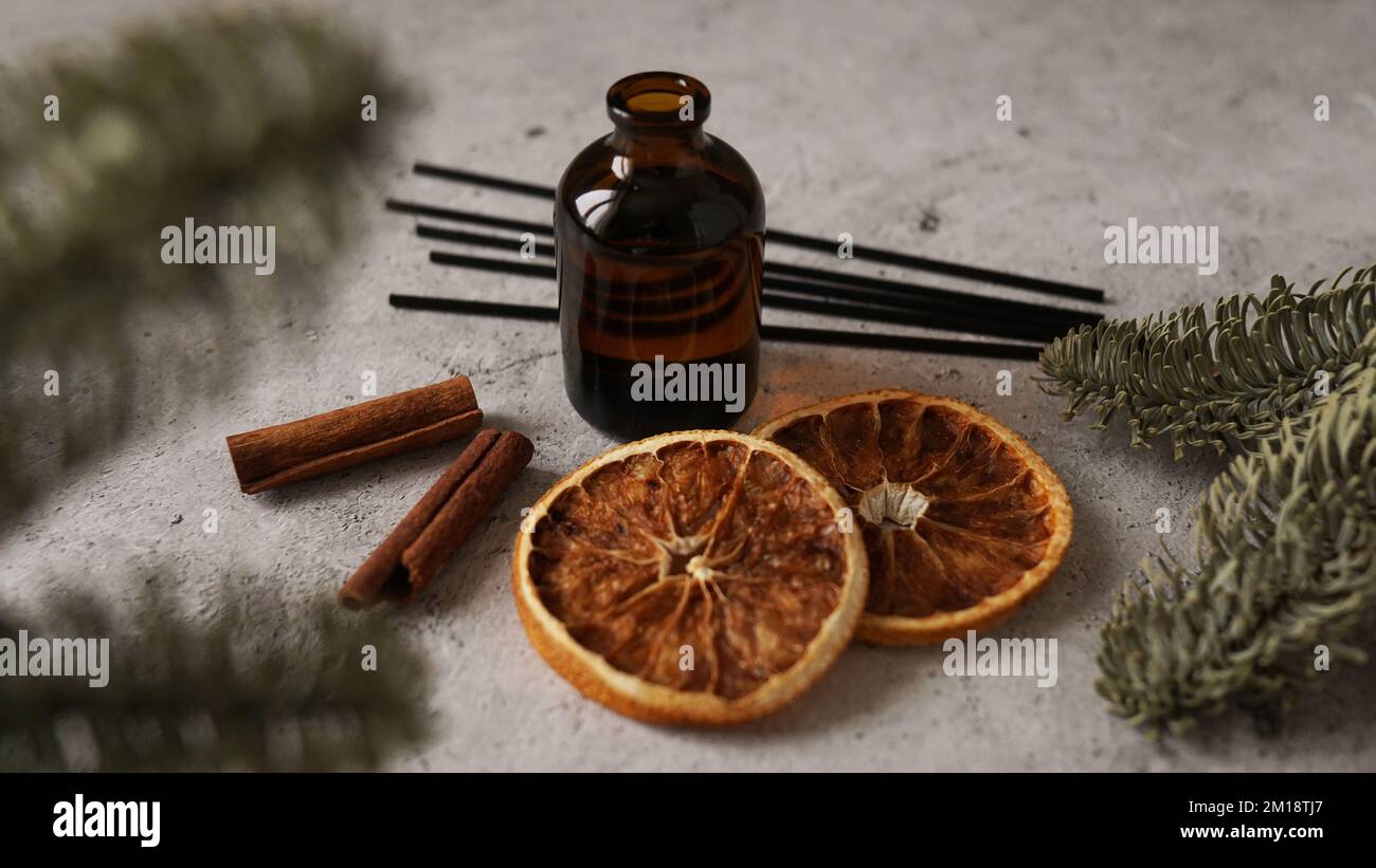 Citrus reed diffuser with cinnamon, dry orange and fir tree branches