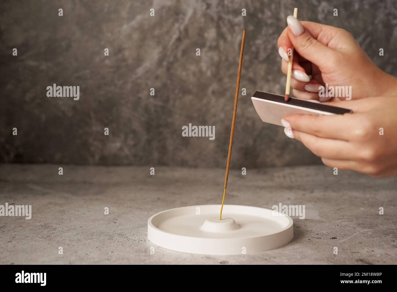 Womans hand burning incense sticks hi-res stock photography and images ...