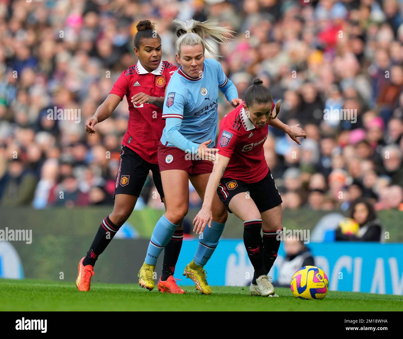 Manchester, UK. 11th Dec, 2022. Nikita Harris (l) and Ona Battle of Manchester Utd (r) box in Lauren Hemp of Manchester City during the The FA Women's Super League match at the Etihad Stadium, Manchester. Picture credit should read: Andrew Yates/Sportimage Credit: Sportimage/Alamy Live News Stock Photo