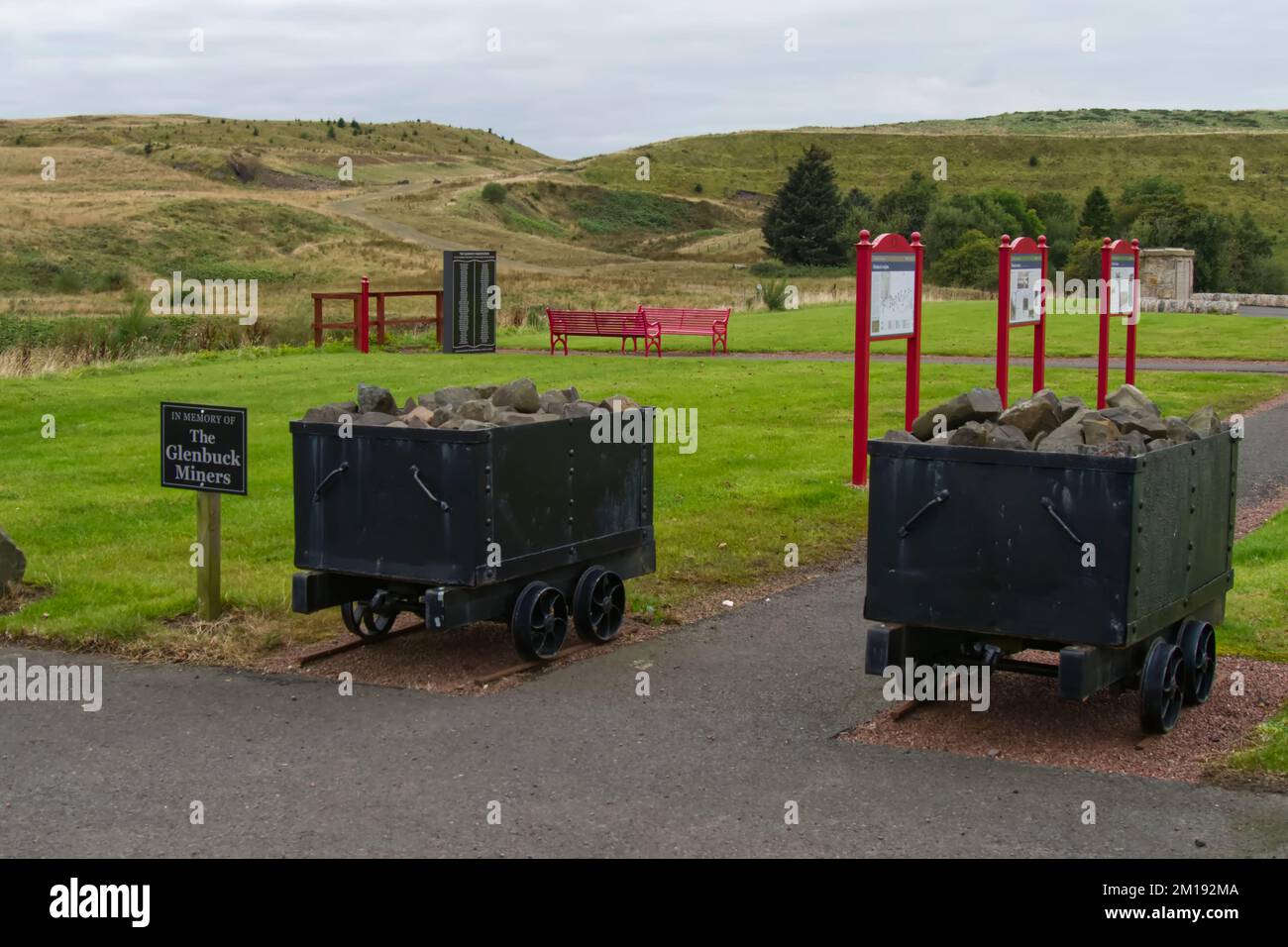 a pair of old mine wagons at the entrance to Glenbuck Heritage Village,Ayrshire,Scotland,UK Stock Photo