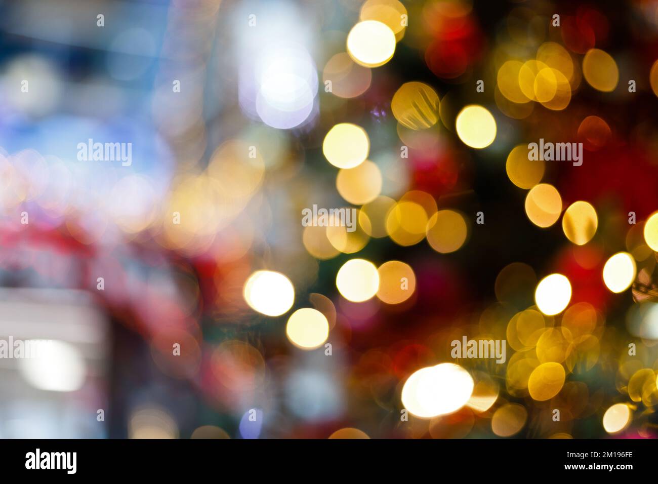Close up of balls on christmas tree. Bokeh garlands in the background. New Year concept Stock Photo