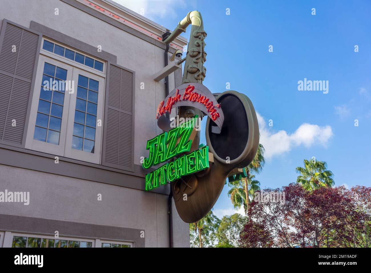 Anaheim, CA, USA – November 1, 2022: A saxophone neon sign on a building for the Jazz Kitchen in Anaheim, California. Stock Photo
