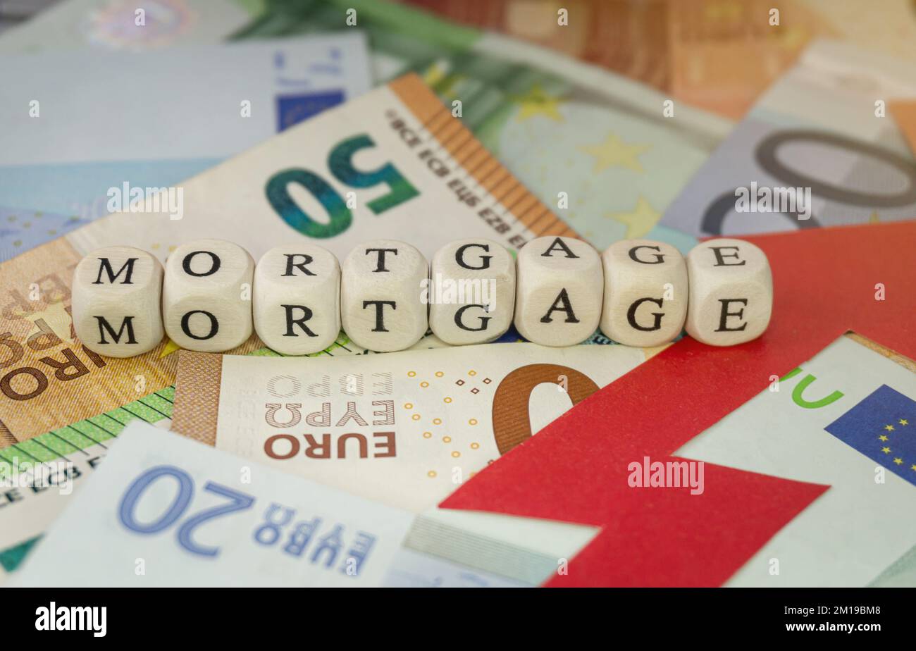 Mortgage sign on Euro banknotes, and red rising arrow. Concept of mortgage interest rates increase, inflation. Stock Photo