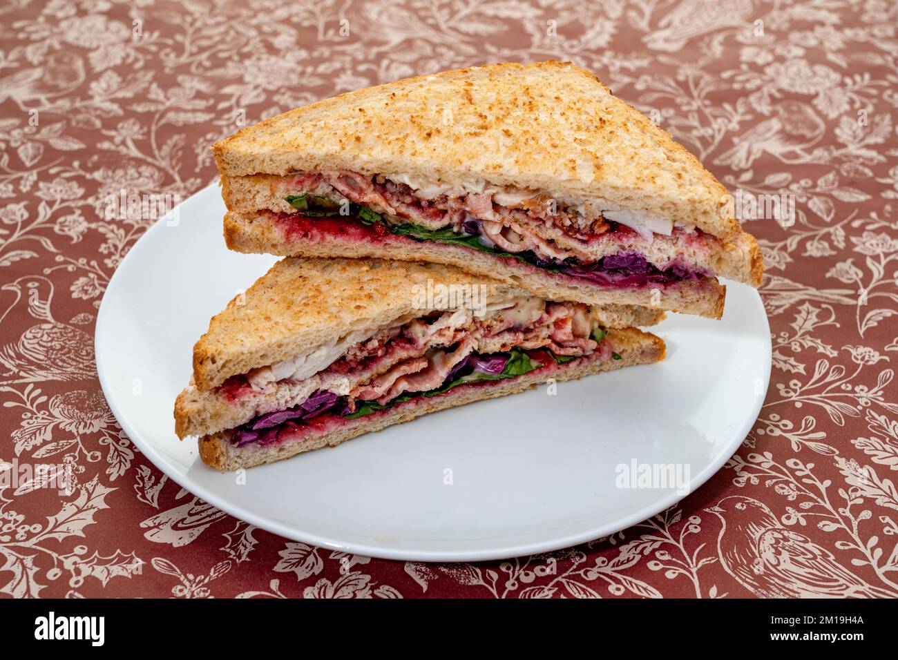 Christmas themed sausage of roast turkey, bacon, stuffing, red cabbage