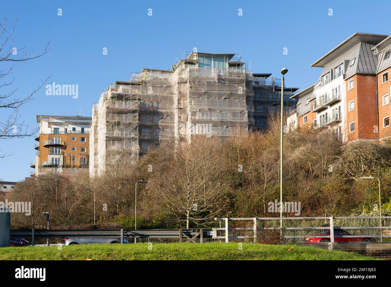High rise flats on Winterthur Way, Basingstoke, December 2022. Stanlil contractors removing cladding panels and balcony planking due to fire safety. UK Stock Photo