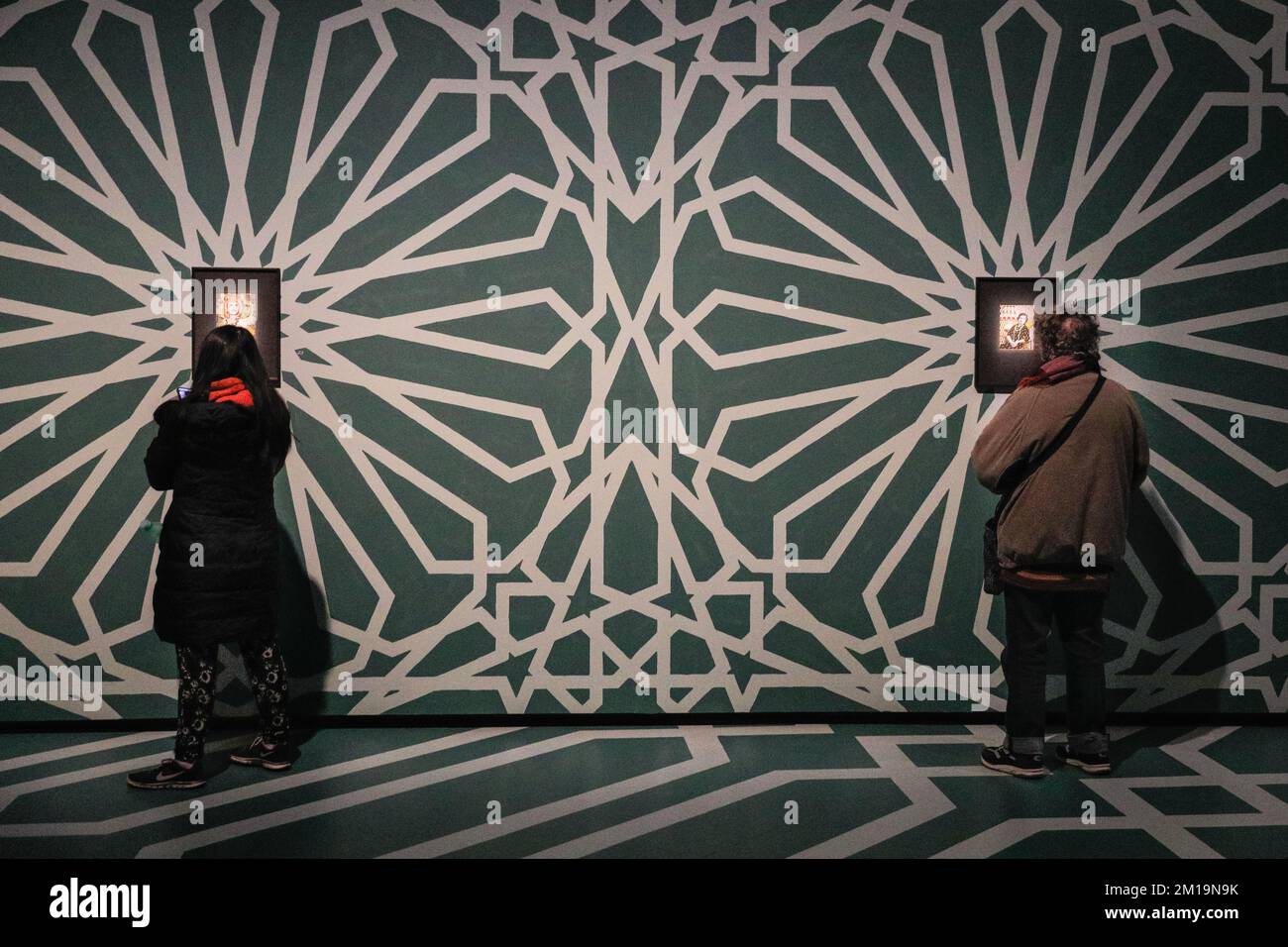 London, UK. 11th Dec, 2022. Visitors look at the works on display. The