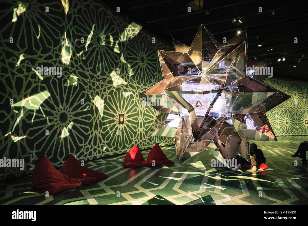 London, UK. 11th Dec, 2022. Visitors look at a starshaped extravagant