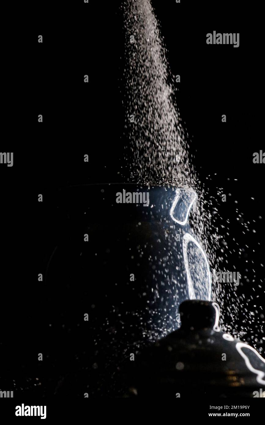 Sugar spill flow low light Stock Photo Alamy