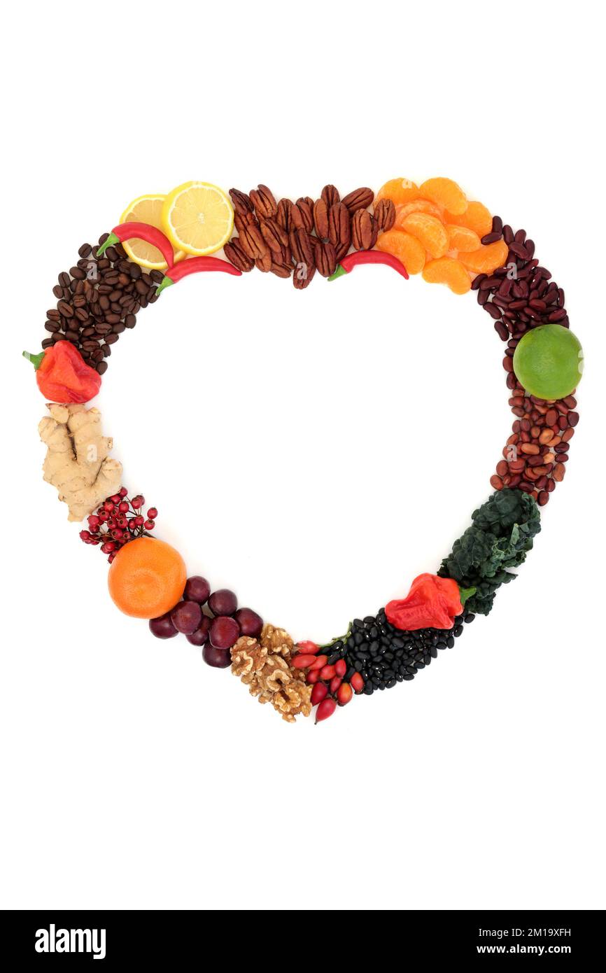 Healthy heart food shaped wreath high in nutrients of flavonoids, polyphenols, antioxidant, anthocyanin, lycopene, vitamins, proteins, bio flavonoid. Stock Photo