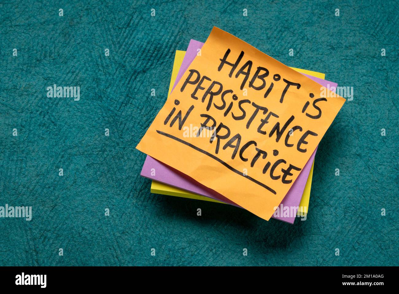 habit is a persistence in practice - inspirational reminder note, personal development concept Stock Photo