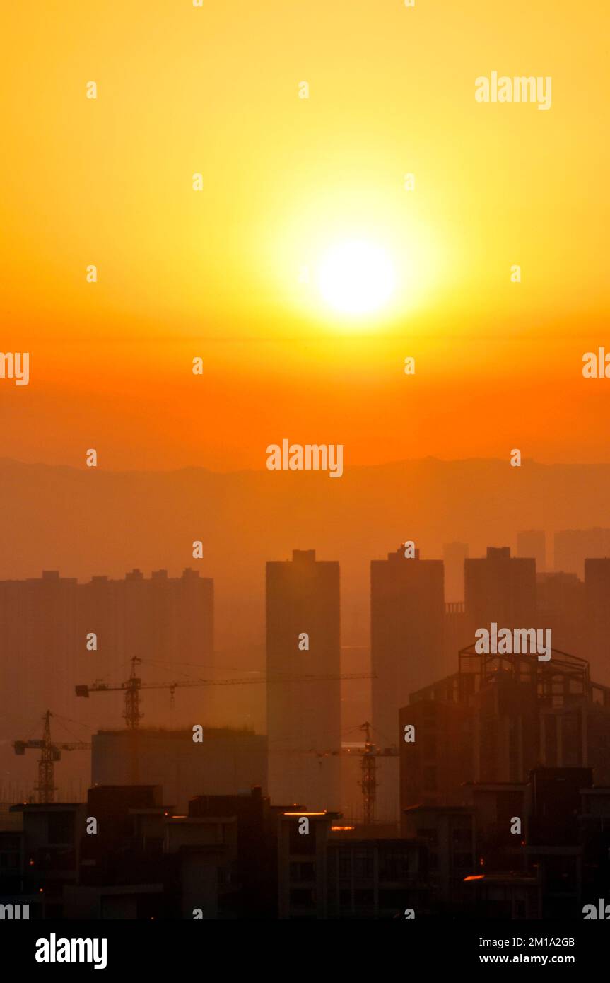 sunset over the city Stock Photo - Alamy