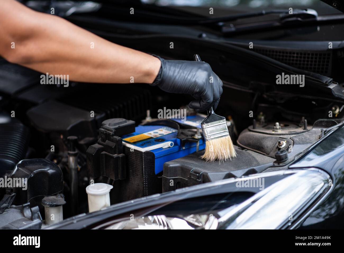 Cleaning the engine bay. Car cleaning and car detailing concept Stock