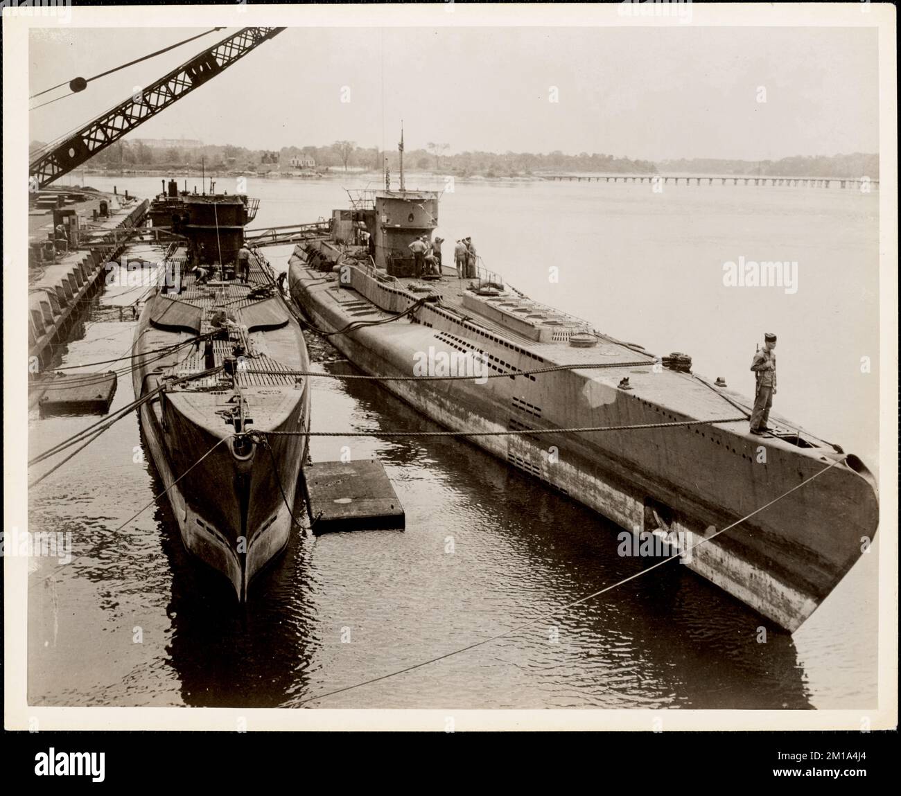 Two of the German U Boats are shown being unloaded , Submarines. Photographs of the First Naval District Stock Photo