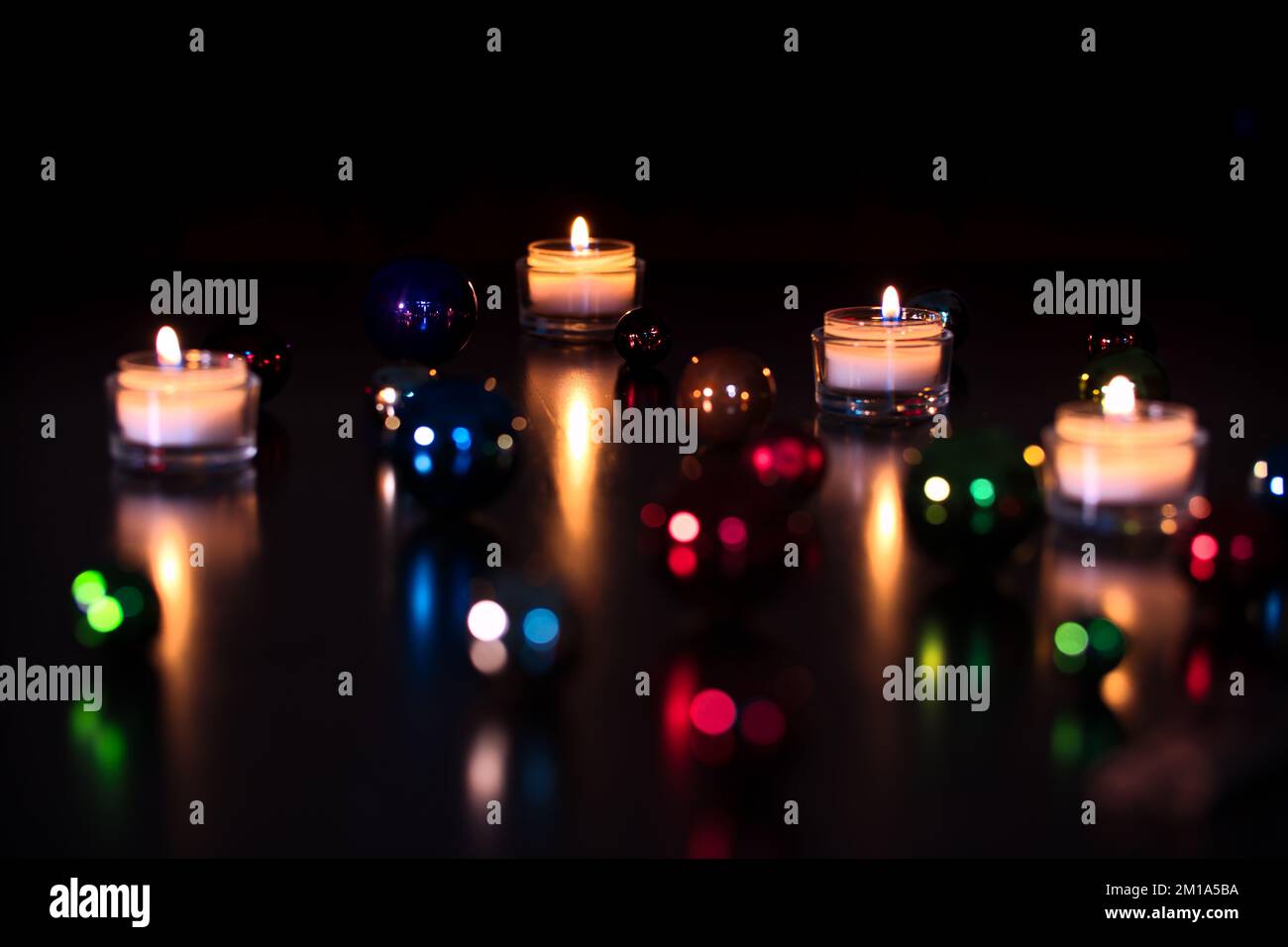 Focus on background with blurry baubles Stock Photo