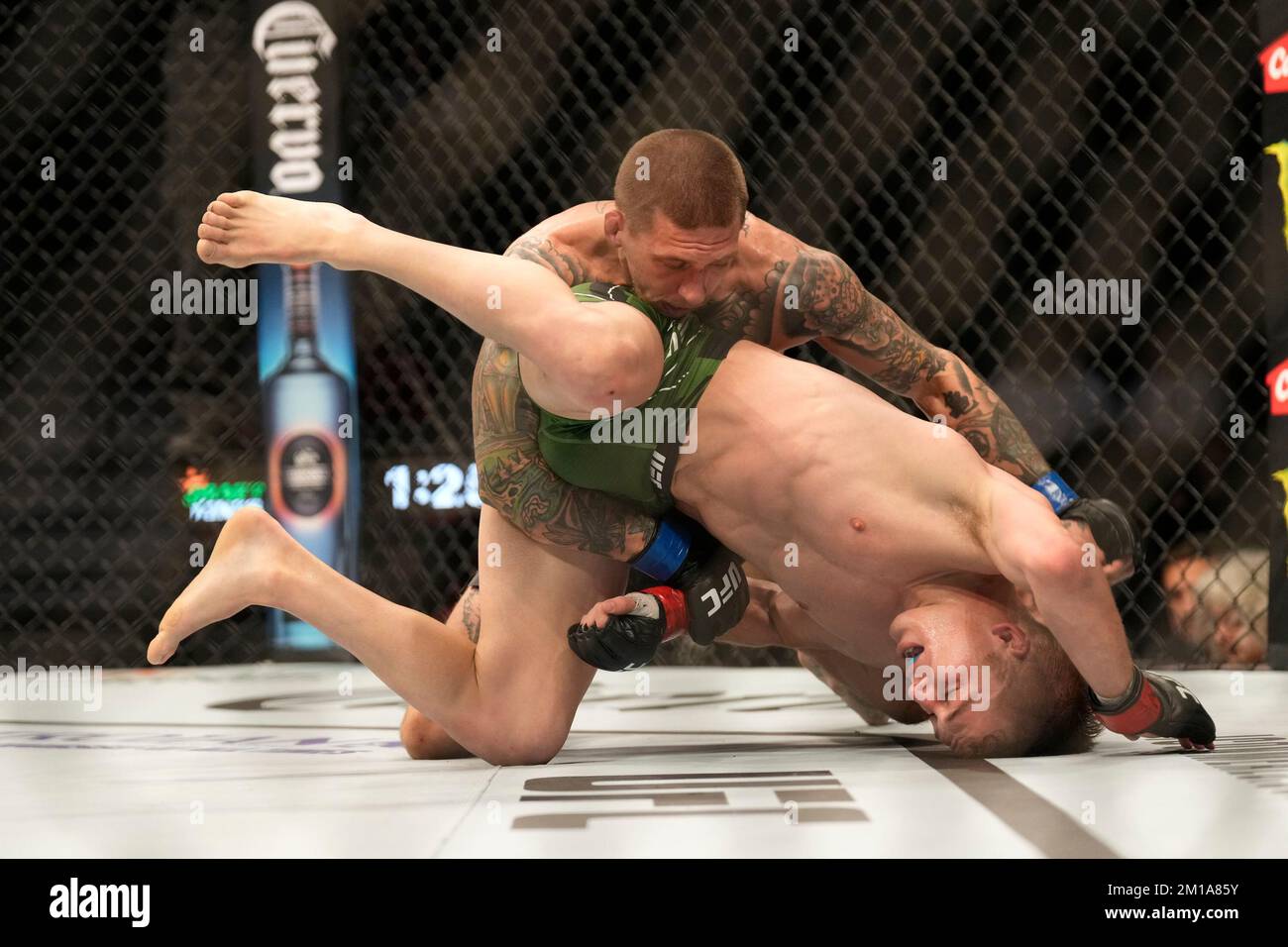 LAS VEGAS, NV - DECEMBER 10: Steven Koslow (top) controls the body of Cameron Saaiman in their Bantamweight fight during the UFC 282 event at T-Mobile Arena on December 10, 2022 in Las Vegas, Nevada, United States. (Photo by Louis Grasse/PxImages) Stock Photo