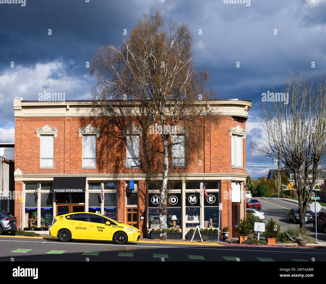 Kirkland, WA, USA - March 31, 2022; Storm light on historic Masonic Lodge or Campbell Building in Kirkland Stock Photo