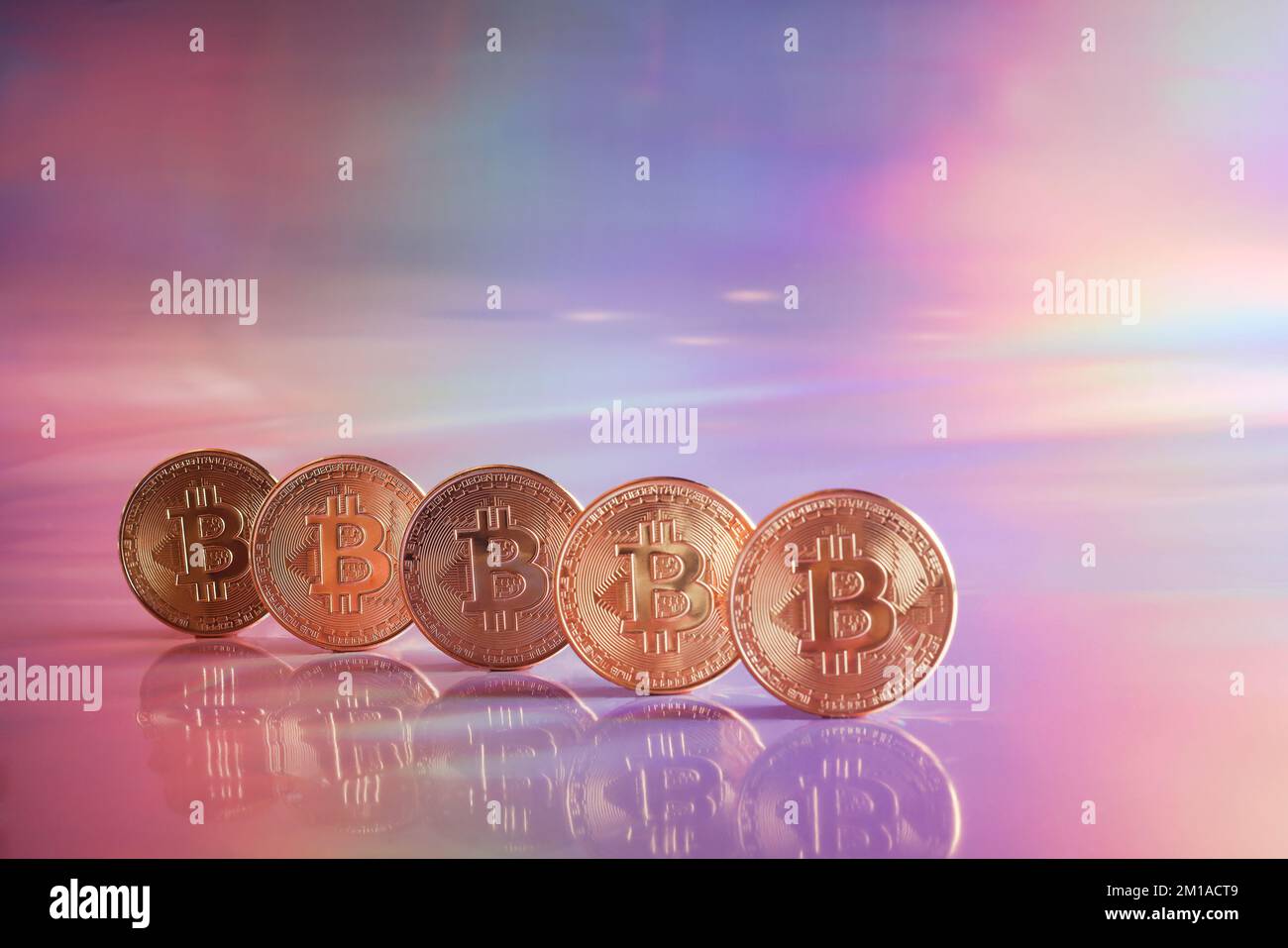 Golden bitcoin coins on holographic, abstract, neon background. digital currency, business style. Mining and trade bitcoin concept. copy space Stock Photo