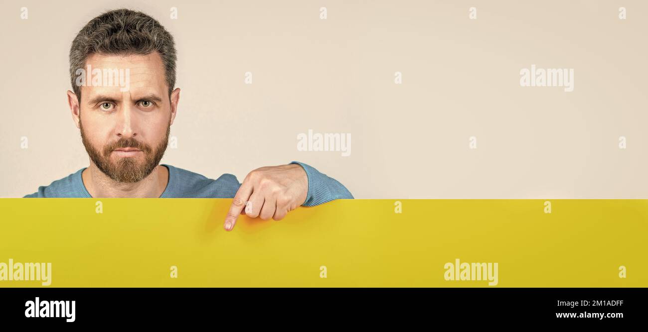 Man face portrait, banner with copy space. for your marketing design. bearded man with paper