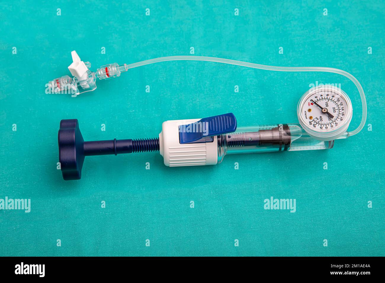 A balloon inflation device used in angioplasty procedure. Mesh metal