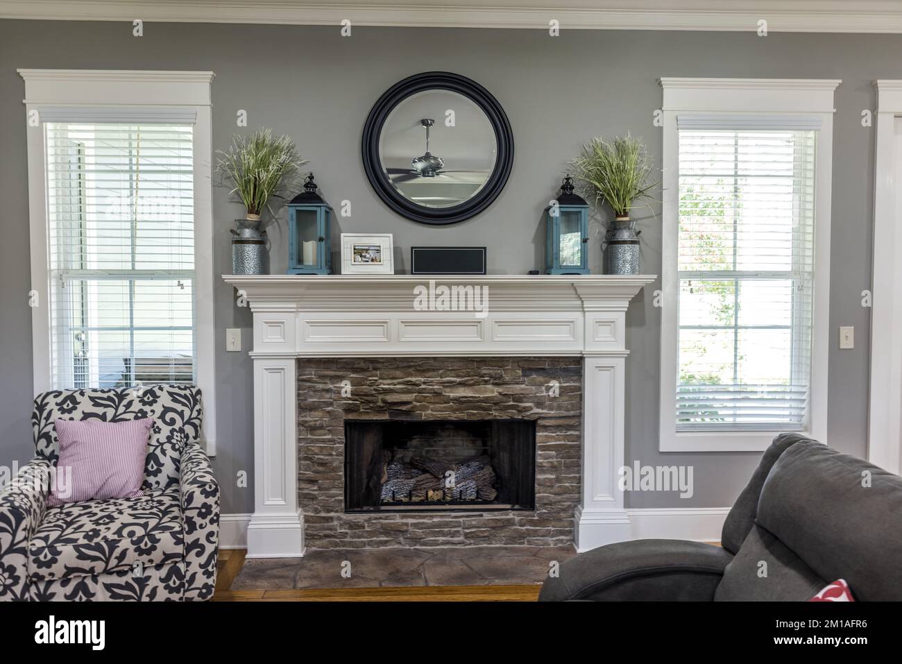White Brick Fireplace With Gray Walls