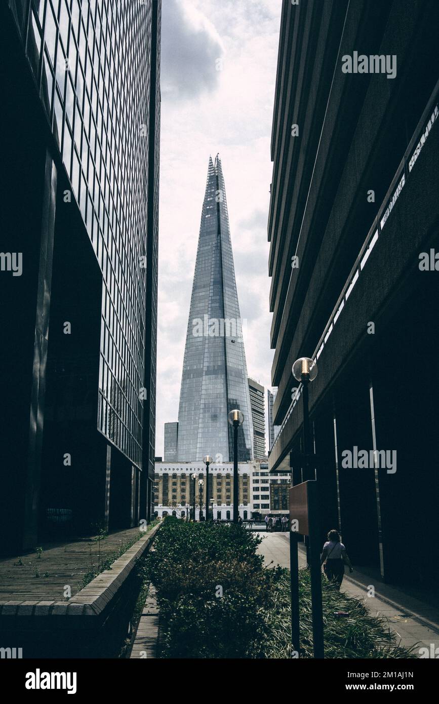 A vertical shot of the Shard skyscraper in London city against the ...