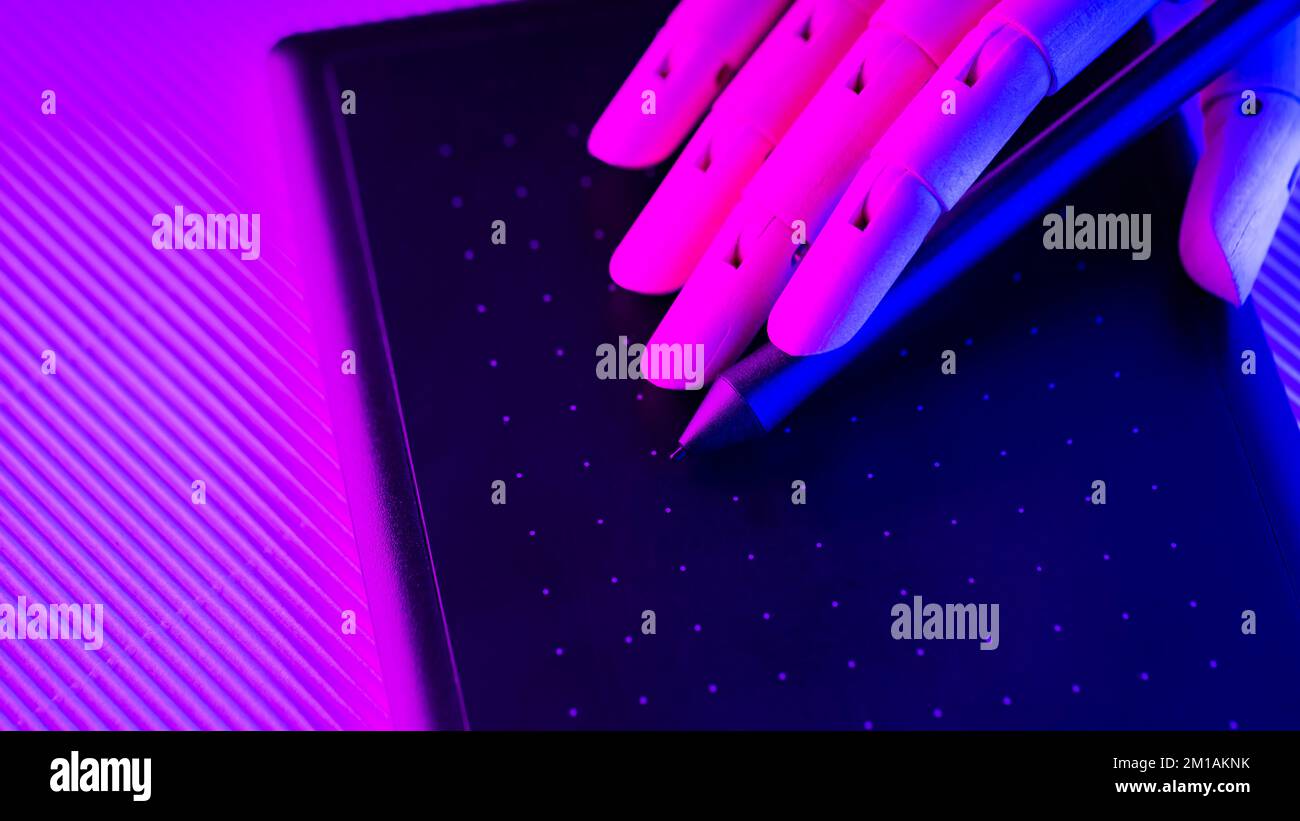 Artificial arm works on a graphics tablet. Creating graphic design with artificial intelligence