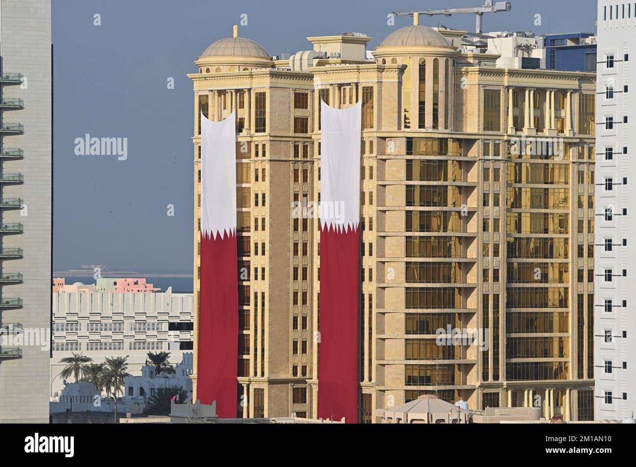 Doha, Katar. 11th Dec, 2022. Qatari flag, flags, flags hanging on a
