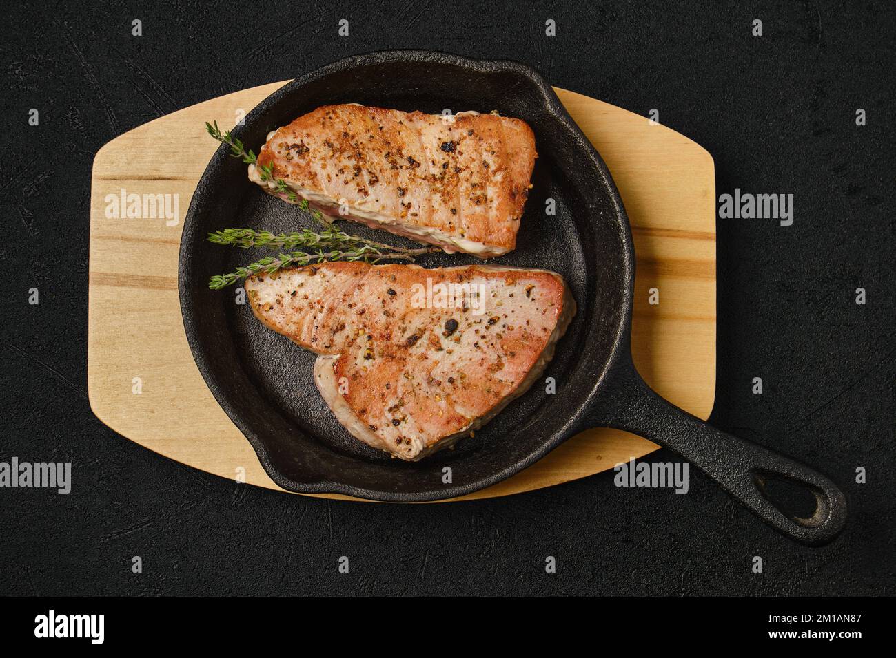 Top view of roasted tuna steak in cast iron pan Stock Photo Alamy