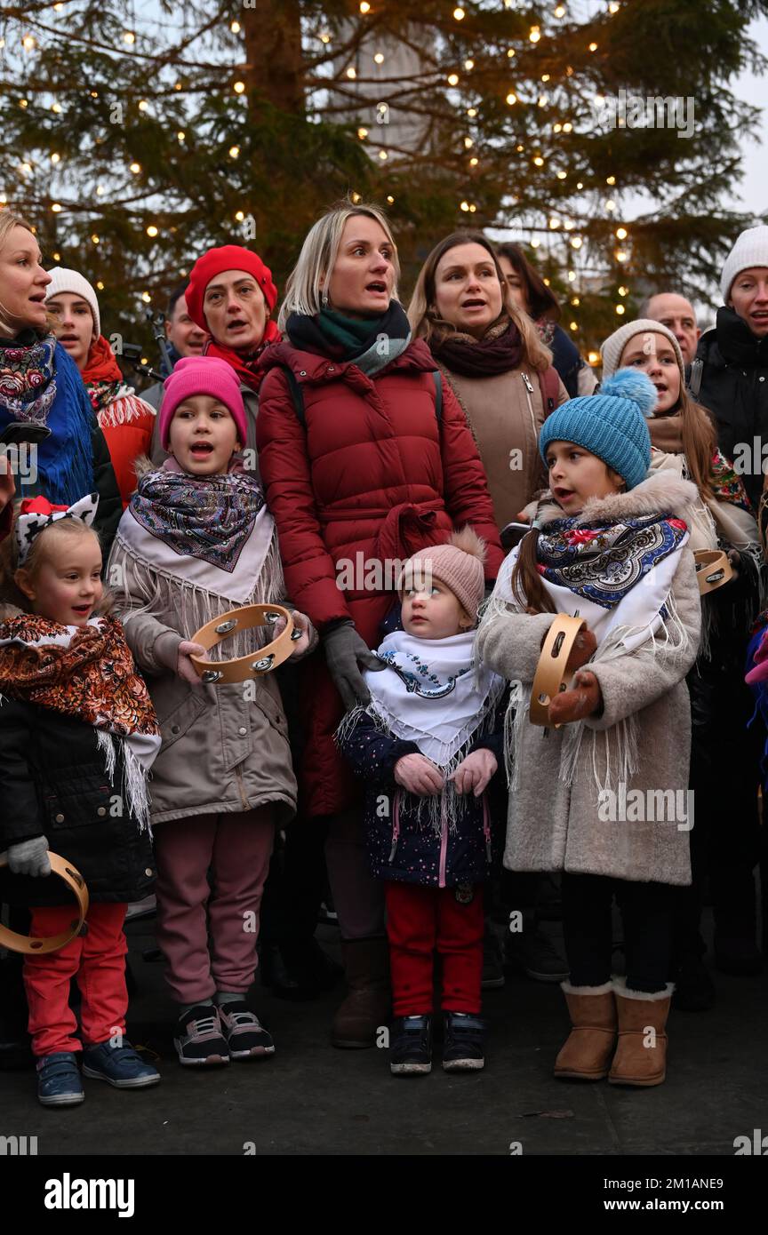 London, United Kingdom. 11th December 2022: The Ukrainian Cathedral Choir for the British Ukrainian Aid - Ukraine Fundraiser with beautiful people singing in Ukrainian and English carols performed under the Christmas tree at Trafalgar Square. Credit: See Li/Picture Capital/Alamy Live News Stock Photo