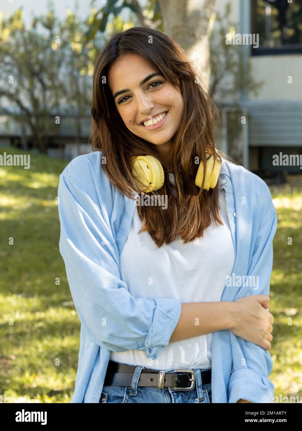 Smiling latin young woman looking at camera Stock Photo