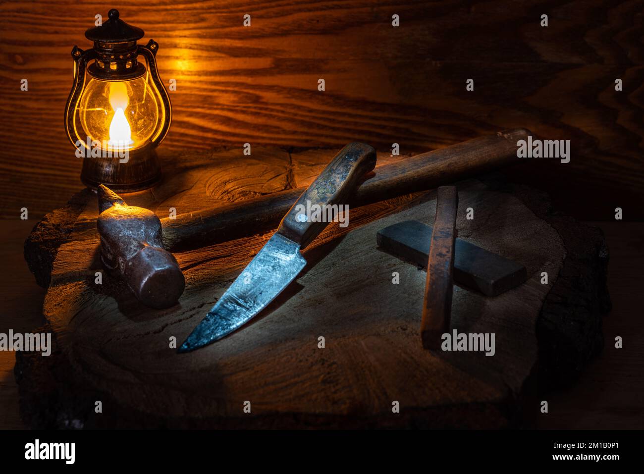 Vintage still life with old hand tools and a candle. Old hammer and