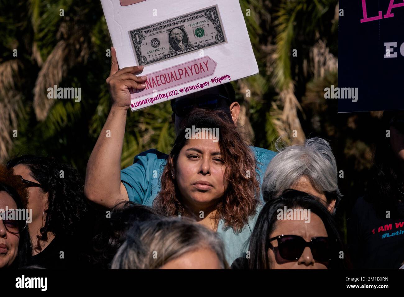 San Diego city officials and activists came together to call on business and government officials to address pay inequities for Latinas in San Diego, CA on Dec. 8, 2022. According to Mexican-American Women's National Association or MANA, Latina Equal Pay Day represents the additional time a Latina needs to work to earn the same annual salary as her White male counterpart. In 2022, the Latina Pay Gap widened. Latinas earn 57 cents for every dollar a White male counterpart makes, represented by 21 additional months of work to earn the same pay. In 2021, Latina Equal Pay Day was observed on Octob Stock Photo