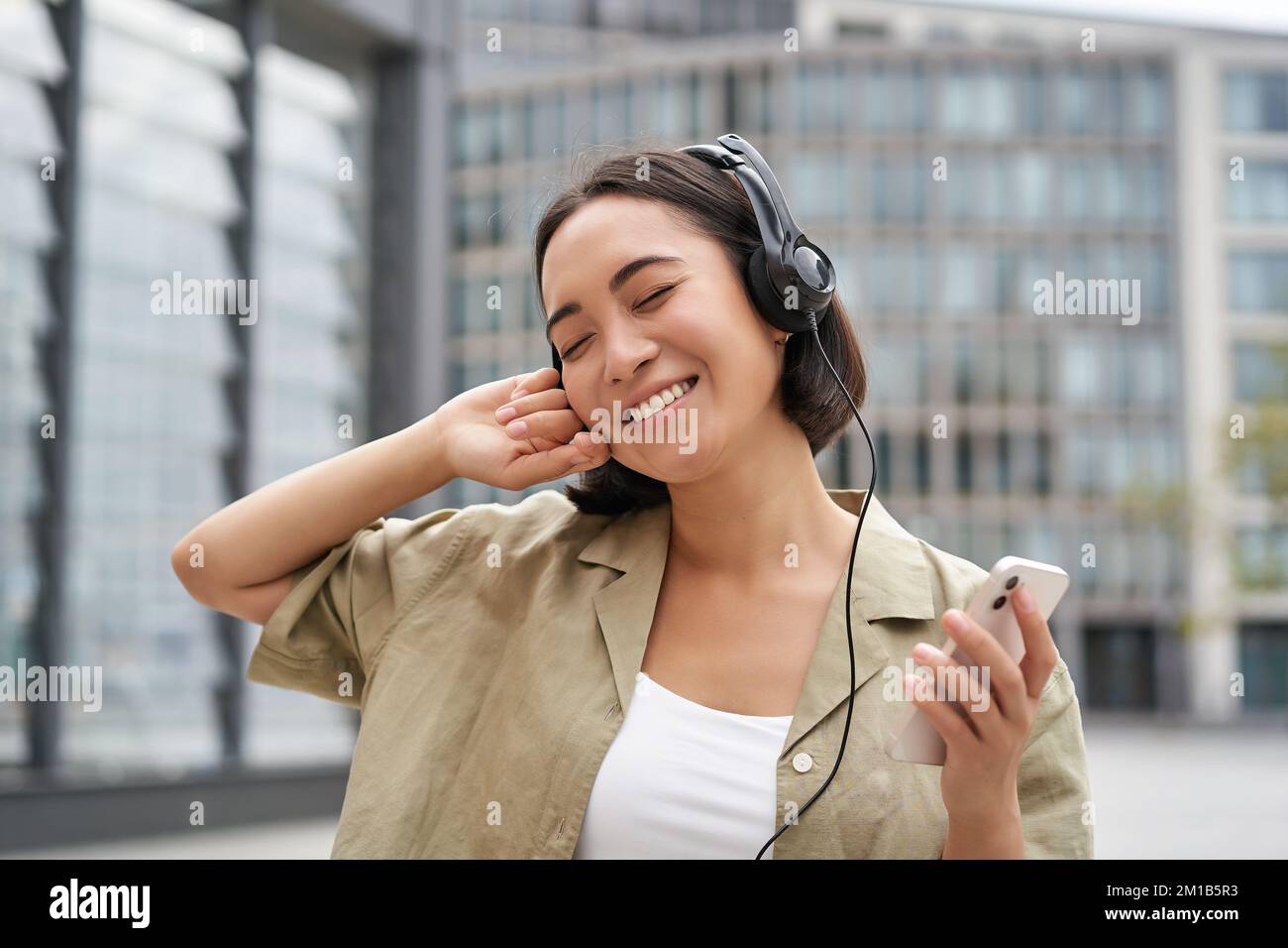 Enjoying the Beat. a Smiling Ethnic Woman Enjoying Her Headphones and  Dancing in Her Pajamas. Stock Photo - Image of ethnic, dance: 276743710