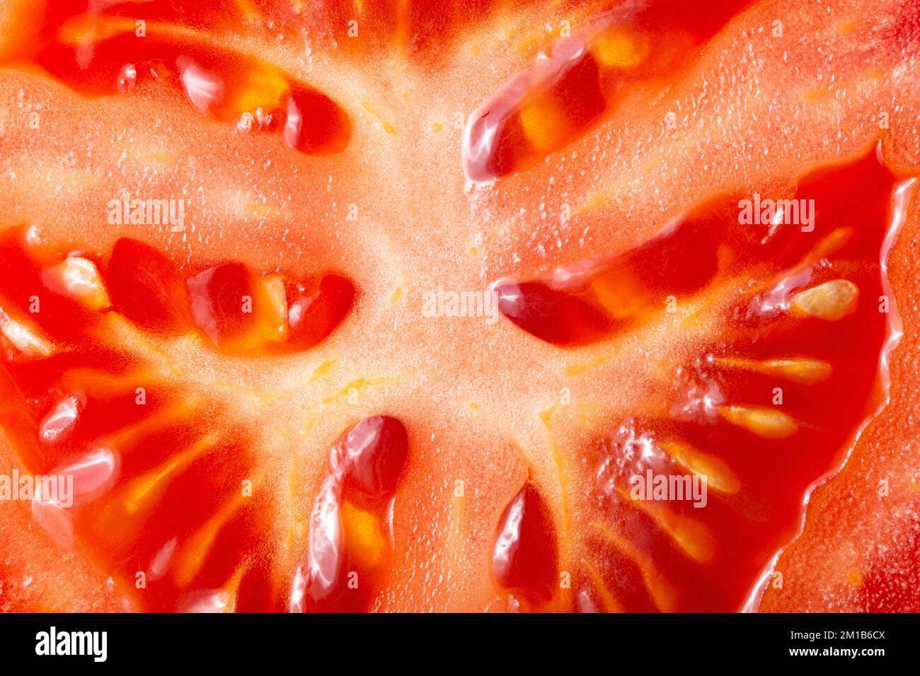 Tomato texture as a background. A close shot of a Tomato . Macro photo. Tomato . Close-up Stock Photo