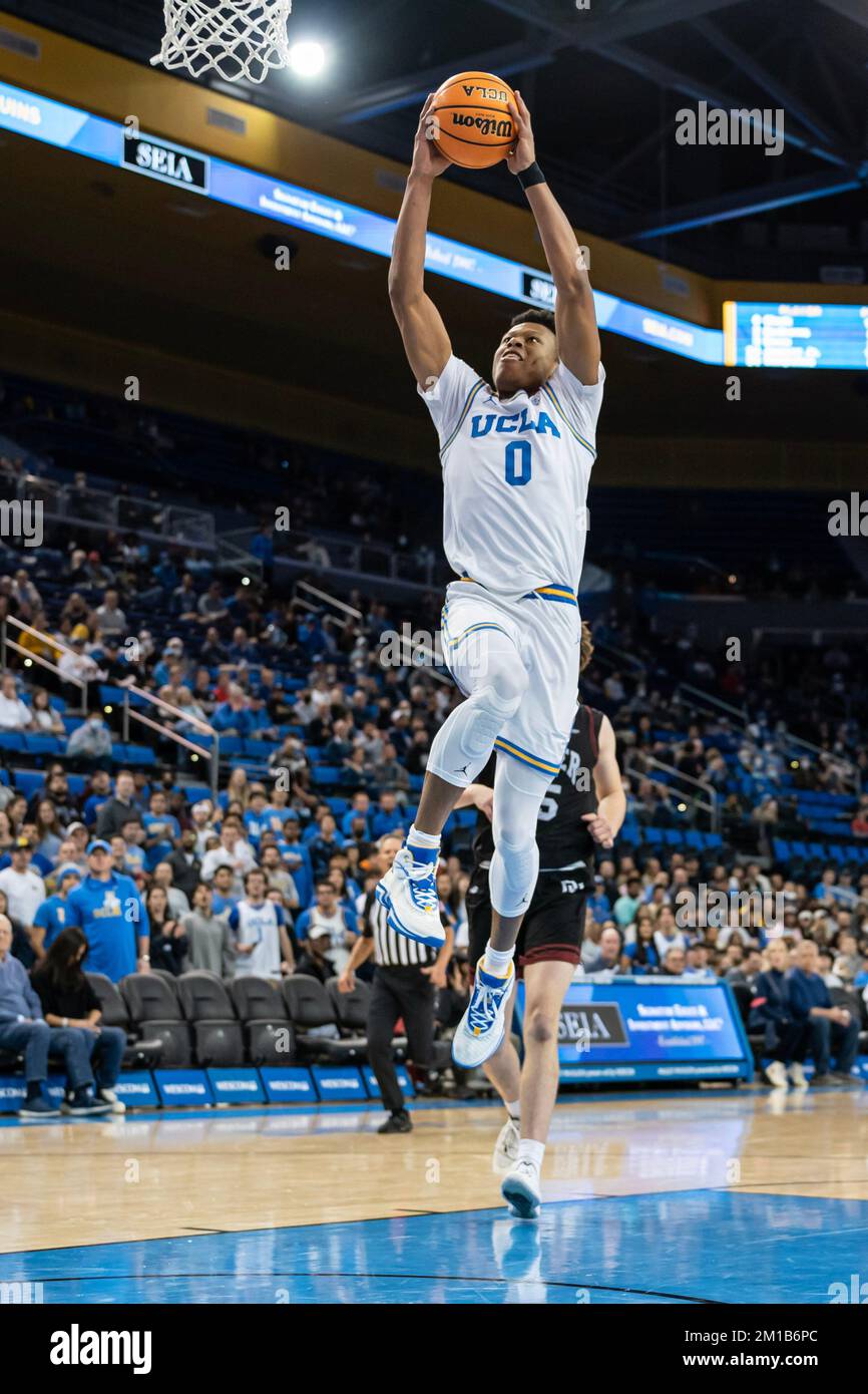UCLA Bruins guard Jaylen Clark (0) goes in for a dunk during a NCAA basketball game against the Denver Pioneers, Saturday, December 10, 2022, at Paule Stock Photo