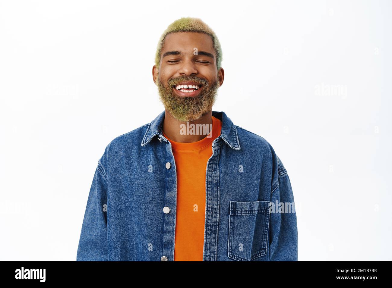Close up of happy smiling Black man with bright yellow beard and hair ...