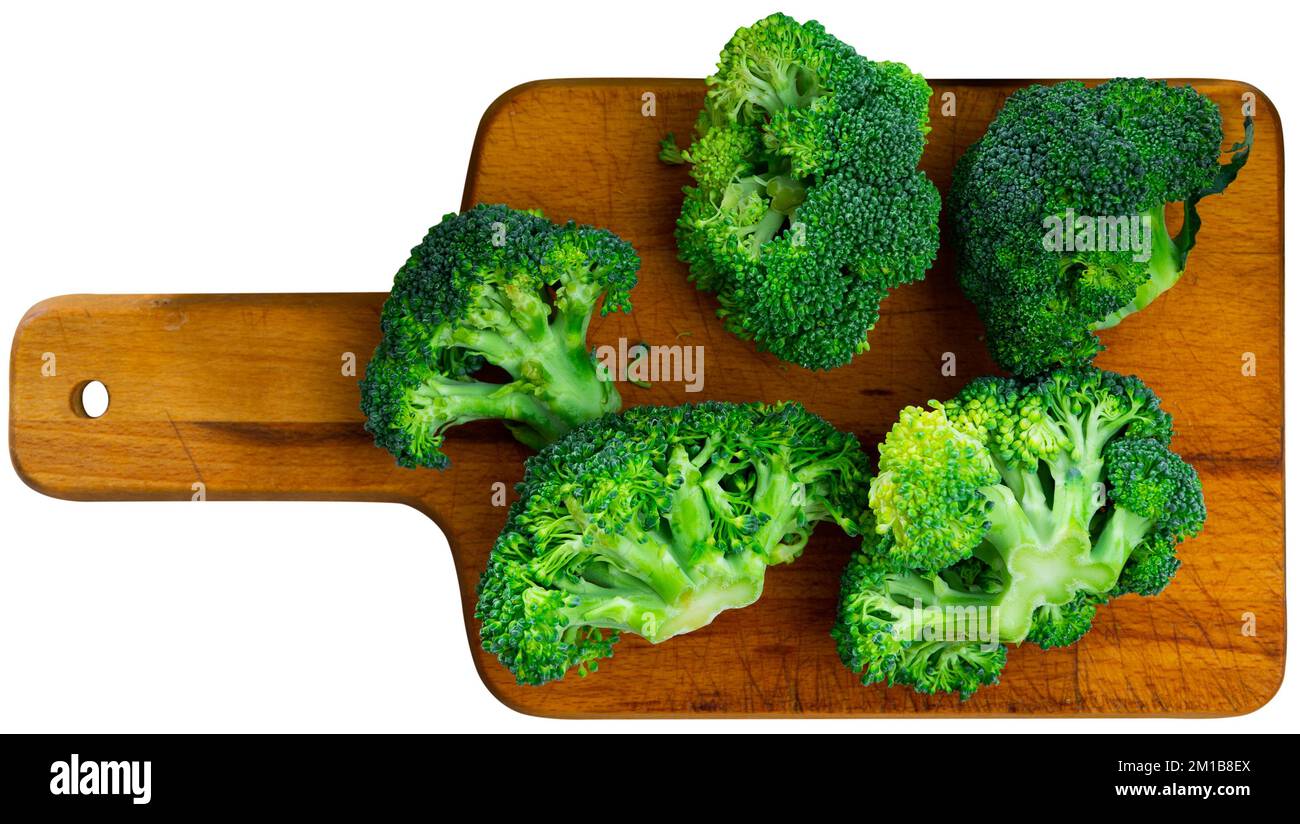 Sliced fresh broccoli on kitchen board Stock Photo
