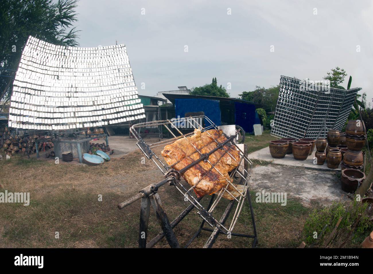 Solar-Barbecued chicken or pork from a glass. Stock Photo