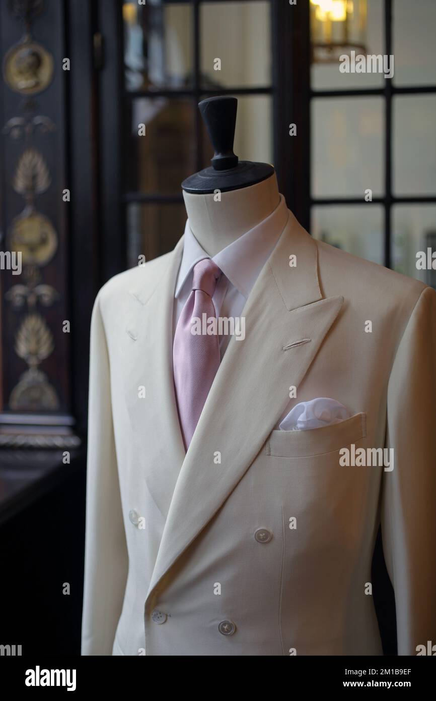Finished mens suit on a bust at Anderson & Sheppard tailors in Old